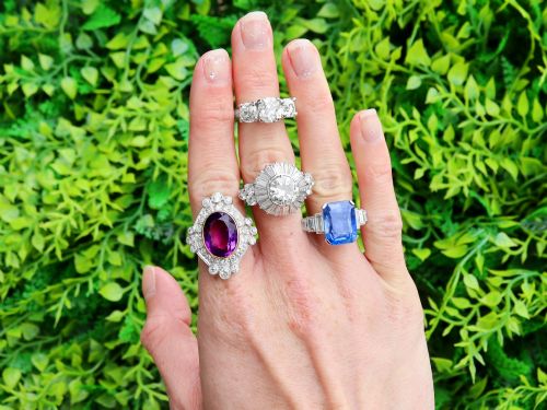 fig 1. An emerald-cut blue sapphire ring set in platinum with stepped baguette diamond shoulders.