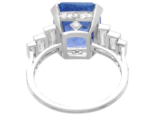 fig 4. An emerald-cut blue sapphire ring set in platinum with stepped baguette diamond shoulders.