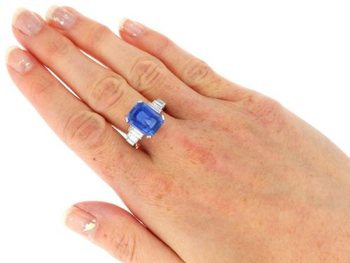 fig 6. An emerald-cut blue sapphire ring set in platinum with stepped baguette diamond shoulders.