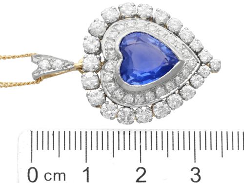 fig 7. A heart-shaped 14ct yellow gold pendant featuring a central heart-cut Ceylon sapphire surrounded by a double halo of brilliant-cut diamonds.