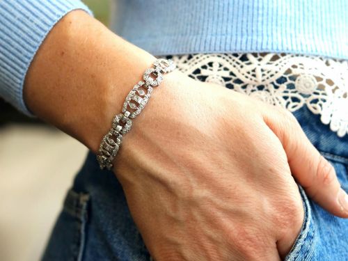 fig 3. An Art Deco platinum bracelet featuring articulated geometric links set with brilliant-cut diamonds.