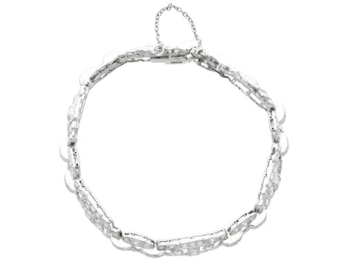 fig 4. An Art Deco platinum bracelet featuring articulated geometric links set with brilliant-cut diamonds.