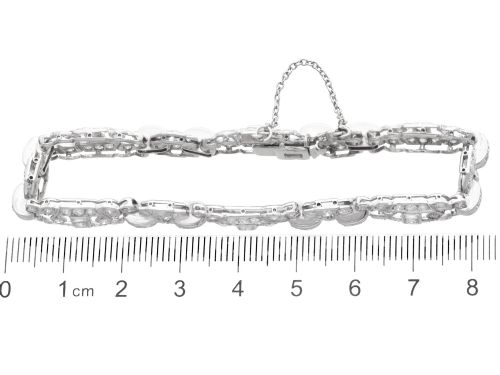 fig 8. An Art Deco platinum bracelet featuring articulated geometric links set with brilliant-cut diamonds.