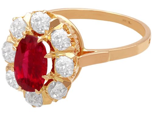 fig 6. An 18ct rose gold cluster ring featuring a central oval red ruby surrounded by eight old cut diamonds set in individual claw settings.