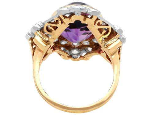 fig 6. An Art Deco ring featuring a central oval purple amethyst set in yellow gold, framed by a millegrain diamond halo.