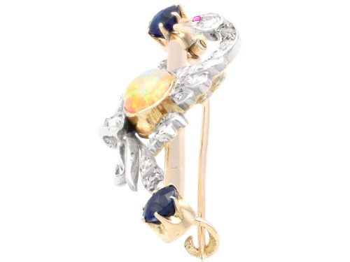 fig 4. An antique Victorian 9ct gold bar brooch featuring a central swan motif set with diamonds and an oval opal body, flanked by two blue sapphires.