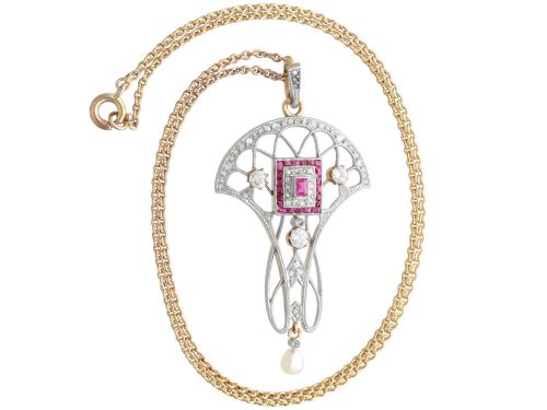 fig 7. An Edwardian openwork yellow gold pendant set with a central square-cut ruby surrounded by small rubies, diamonds, and a suspended natural pearl drop.