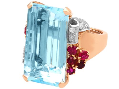 fig 5. A 1940s Retro rose gold cocktail ring set with a large emerald-cut aquamarine flanked by ruby clusters and diamond accents.