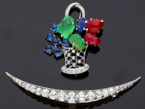fig 5. An antique crescent-shaped brooch set with a row of graduated diamonds mounted in gold and silver.