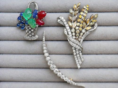 fig 6. An antique crescent-shaped brooch set with a row of graduated diamonds mounted in gold and silver.