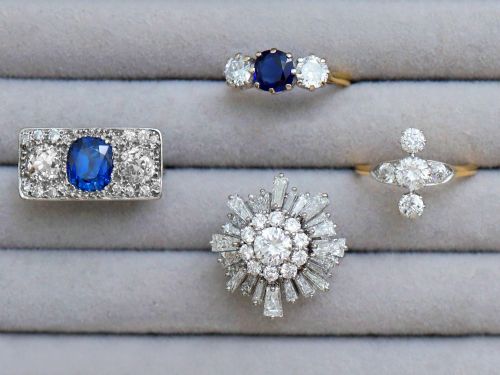 fig 5. An antique 18ct yellow gold ring featuring five old-cut diamonds set in a geometric white metal arrangement.