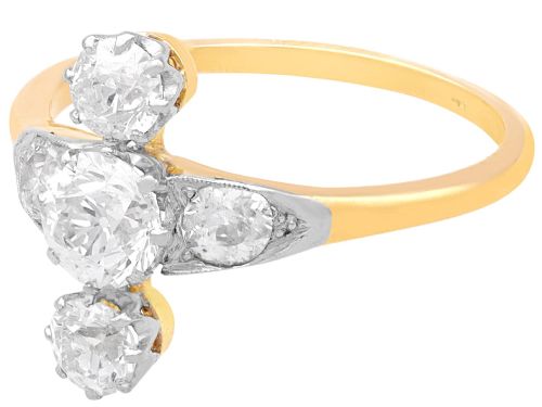 fig 6. An antique 18ct yellow gold ring featuring five old-cut diamonds set in a geometric white metal arrangement.