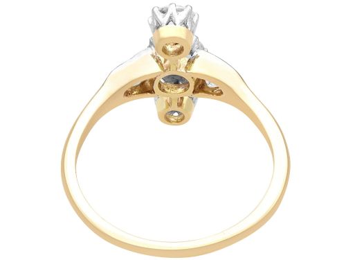 fig 7. An antique 18ct yellow gold ring featuring five old-cut diamonds set in a geometric white metal arrangement.