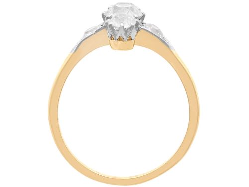 fig 8. An antique 18ct yellow gold ring featuring five old-cut diamonds set in a geometric white metal arrangement.