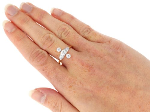 fig 9. An antique 18ct yellow gold ring featuring five old-cut diamonds set in a geometric white metal arrangement.