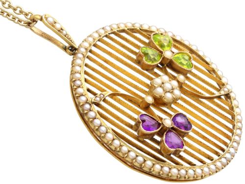 fig 8. A circular 18ct yellow gold openwork pendant set with seed pearls along the outer rim, containing peridot and amethyst trefoil motifs and a central seed pearl cluster.