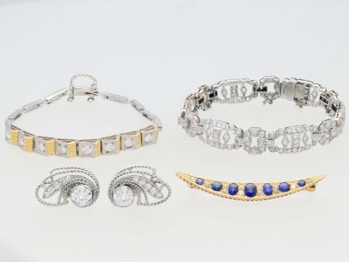 fig 5. An Art Deco two-tone 18ct gold and white metal link bracelet featuring square diamond-set panels alternating with textured gold links.