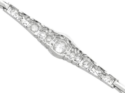 fig 7. An Art Deco 18ct white gold bracelet featuring articulated geometric panels set with diamonds and finished with millegrain edging.