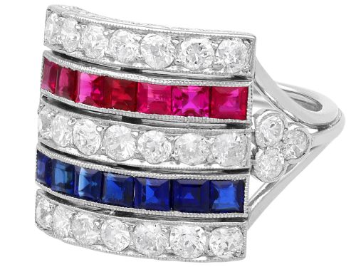 fig 6. An antique platinum ring displaying horizontal rows of round diamonds alternating with channel-set rectangular blue sapphires and red rubies.