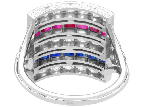 fig 7. An antique platinum ring displaying horizontal rows of round diamonds alternating with channel-set rectangular blue sapphires and red rubies.