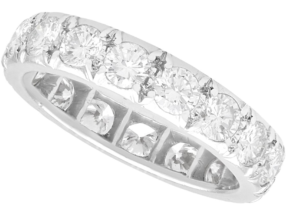 A platinum full eternity ring set with a continuous band of round brilliant cut diamonds in claw settings.
