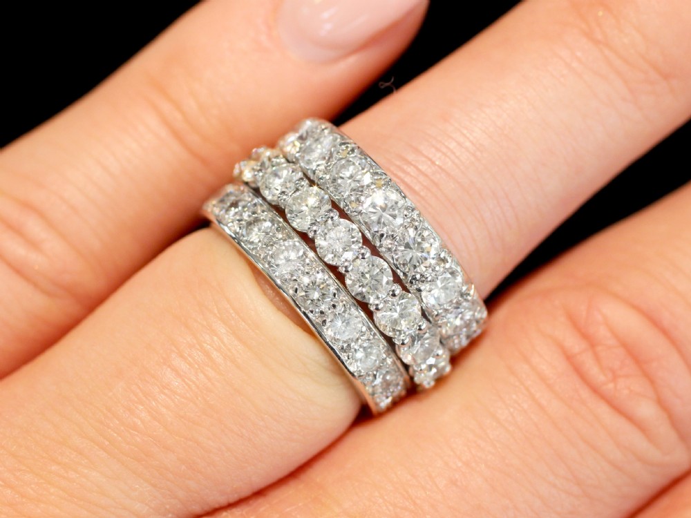 An 18ct white gold full eternity ring set with a continuous circle of round diamonds. View IV
