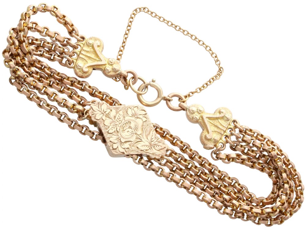 A late Victorian four-strand 9ct yellow gold belcher chain bracelet featuring a central hand-engraved lozenge-shaped panel. View III