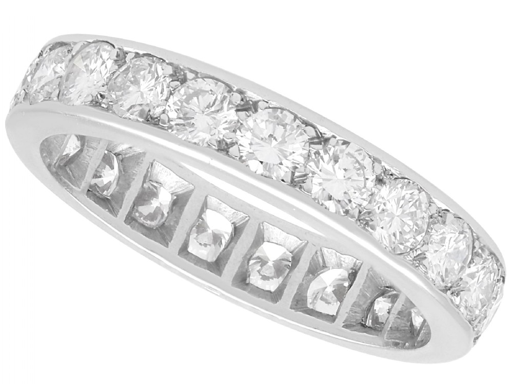 An 18ct white gold full eternity ring set with a continuous circle of brilliant-cut diamonds and featuring a pierced inner gallery.