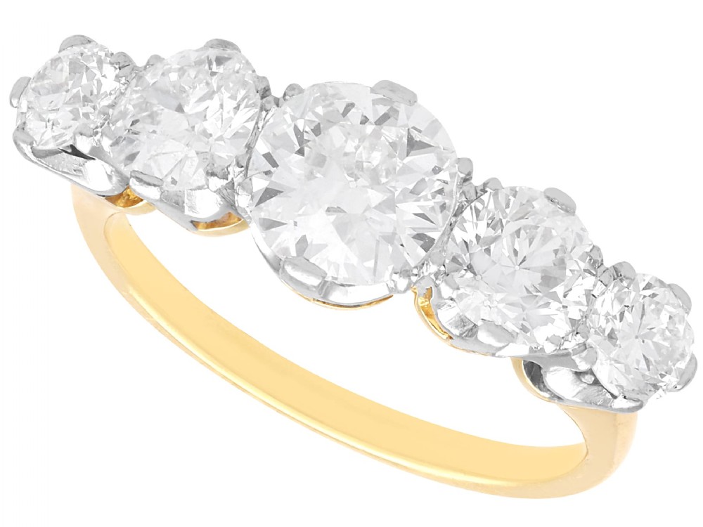 An 18ct yellow gold five stone ring set with five graduated round diamonds in claw settings.
