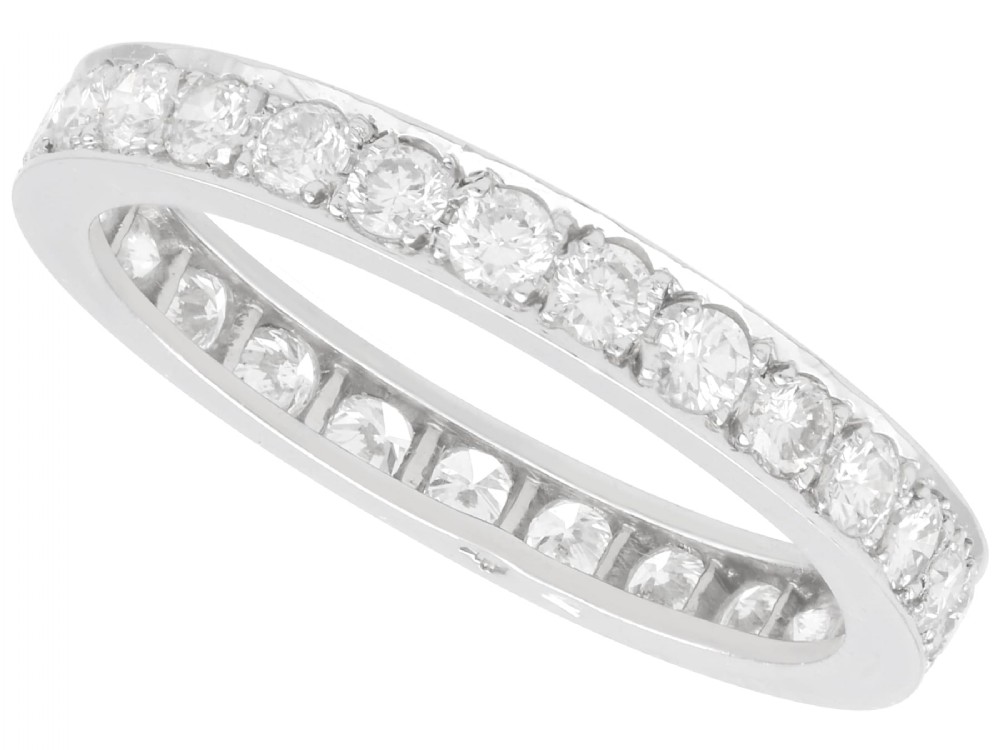 An Art Deco diamond and platinum full eternity band featuring continuous round-cut diamonds set around the entire circumference.