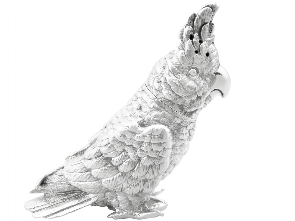 A Victorian sterling silver pepperette cast in the detailed likeness of a cockatoo with pierced holes along its crest.