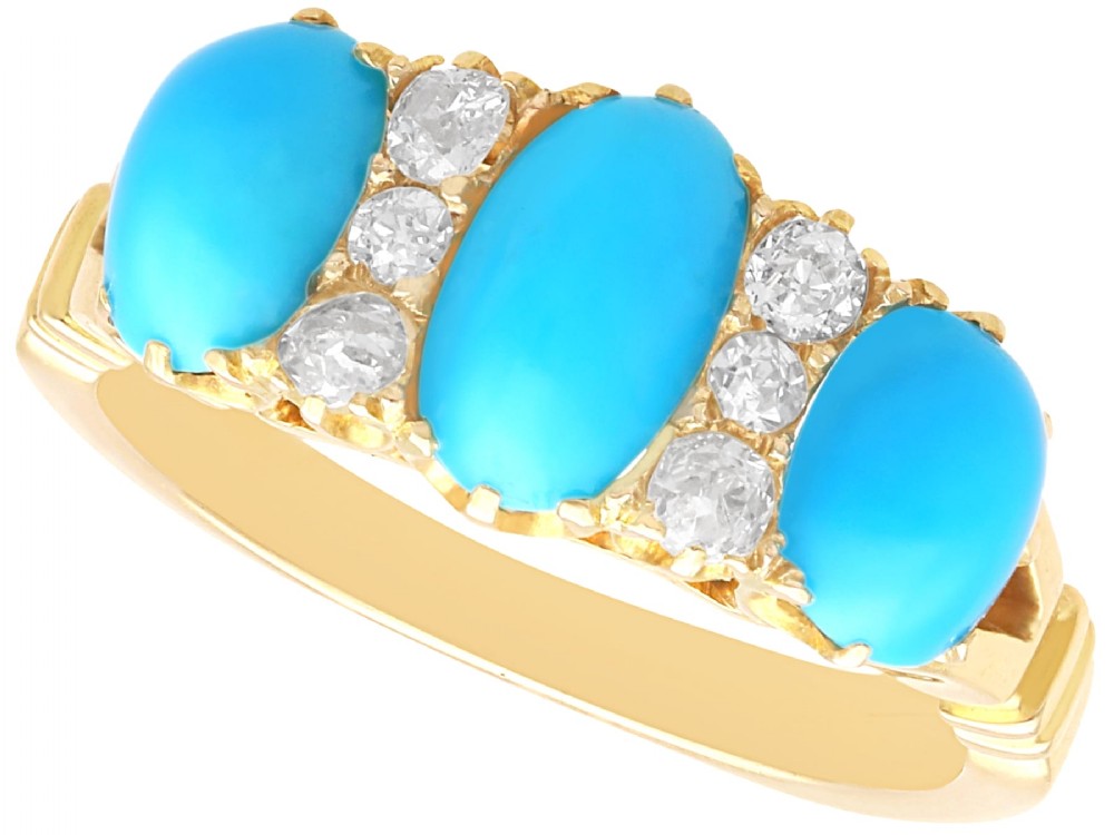 A late Victorian 15ct yellow gold ring featuring three oval turquoise cabochons separated by small diamond accents.