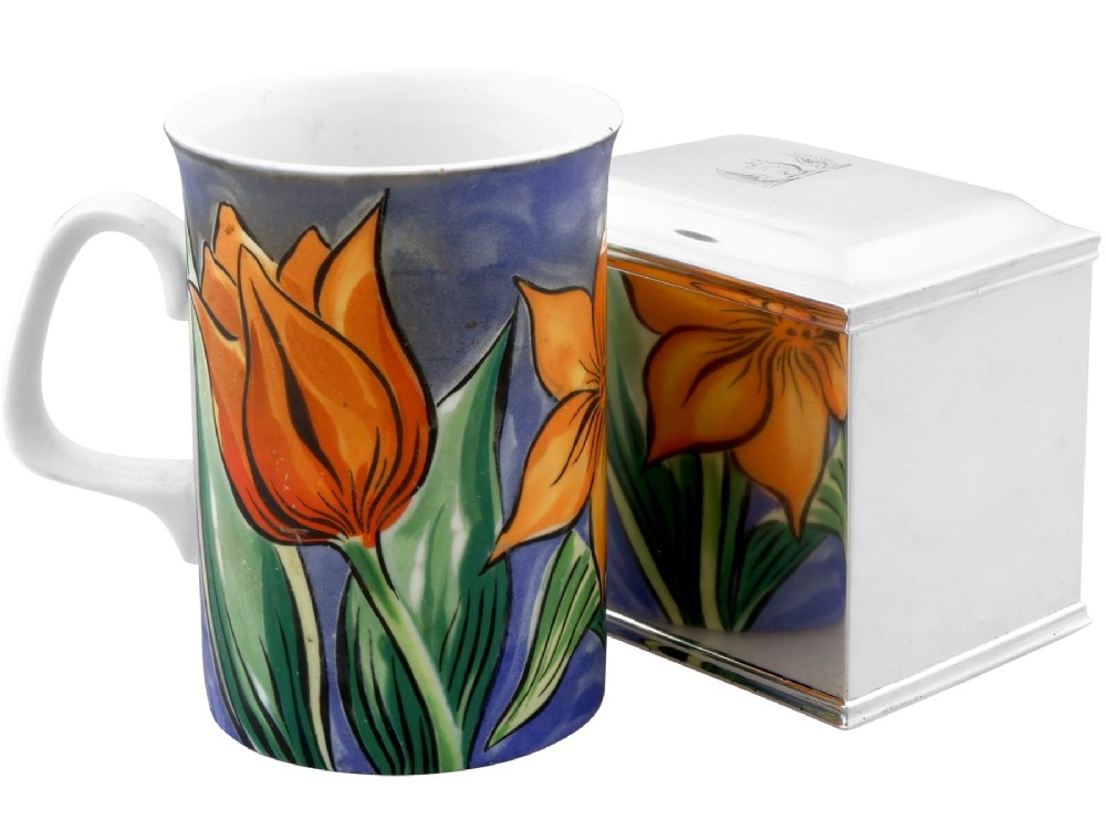 A rectangular George III sterling silver tea caddy featuring a fitted cover engraved with a heraldic crest and stepped moulded borders along the base and top. View V