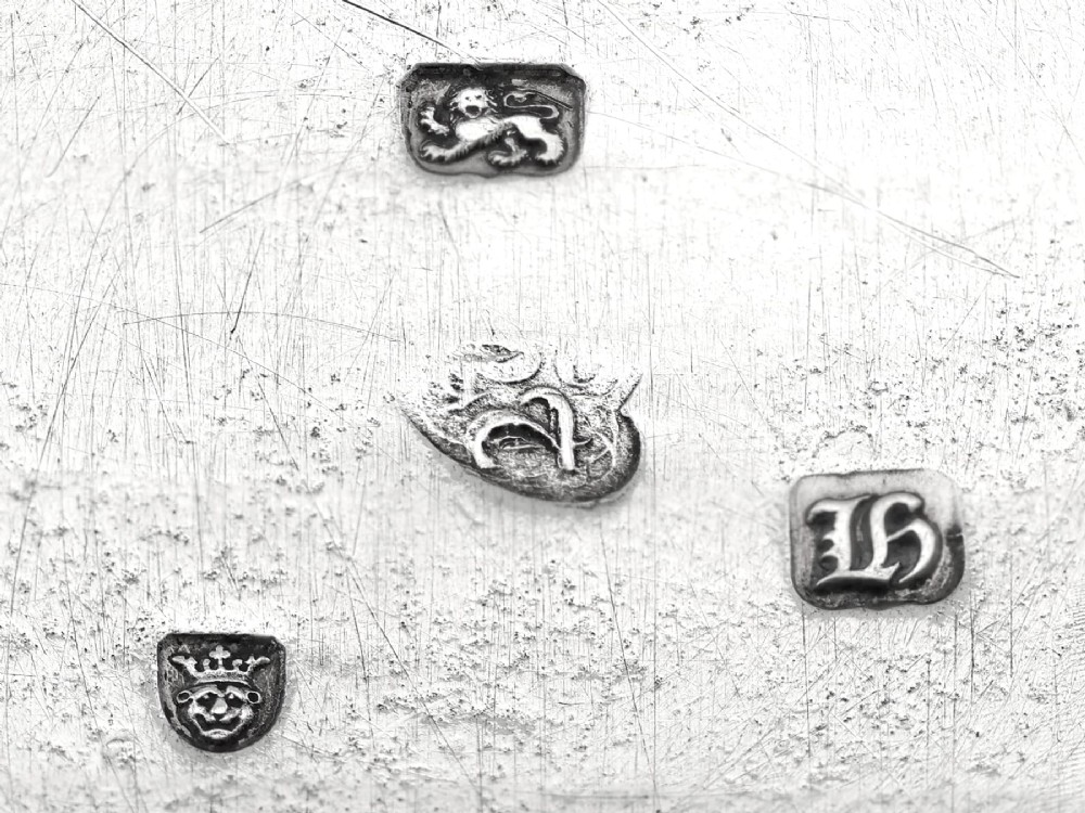 A rectangular George III sterling silver tea caddy featuring a fitted cover engraved with a heraldic crest and stepped moulded borders along the base and top. View VIII