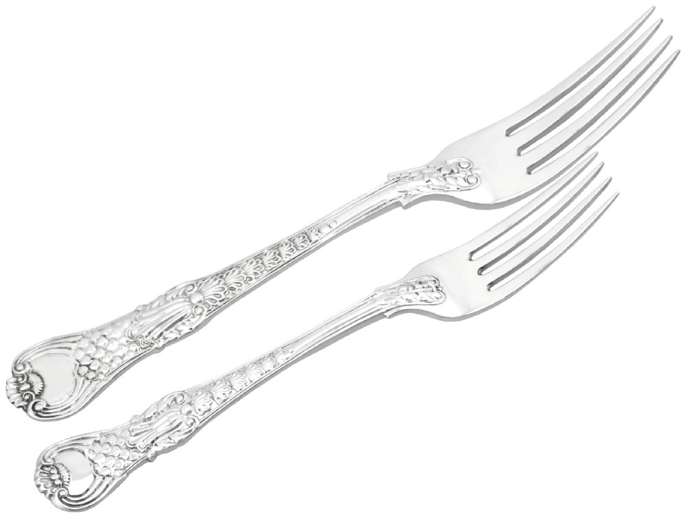 A collection of ornate sterling silver cutlery pieces featuring intricately embossed handles and polished bowls, including ladles, forks, knives, and spoons. View VIII