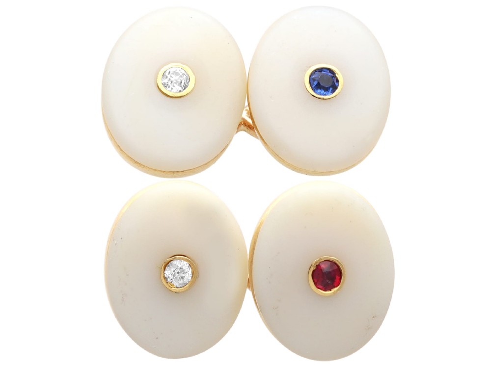 Four oval 15ct yellow gold cufflinks featuring smooth white agate faces with central bezel-set diamond, sapphire, and ruby gemstones.