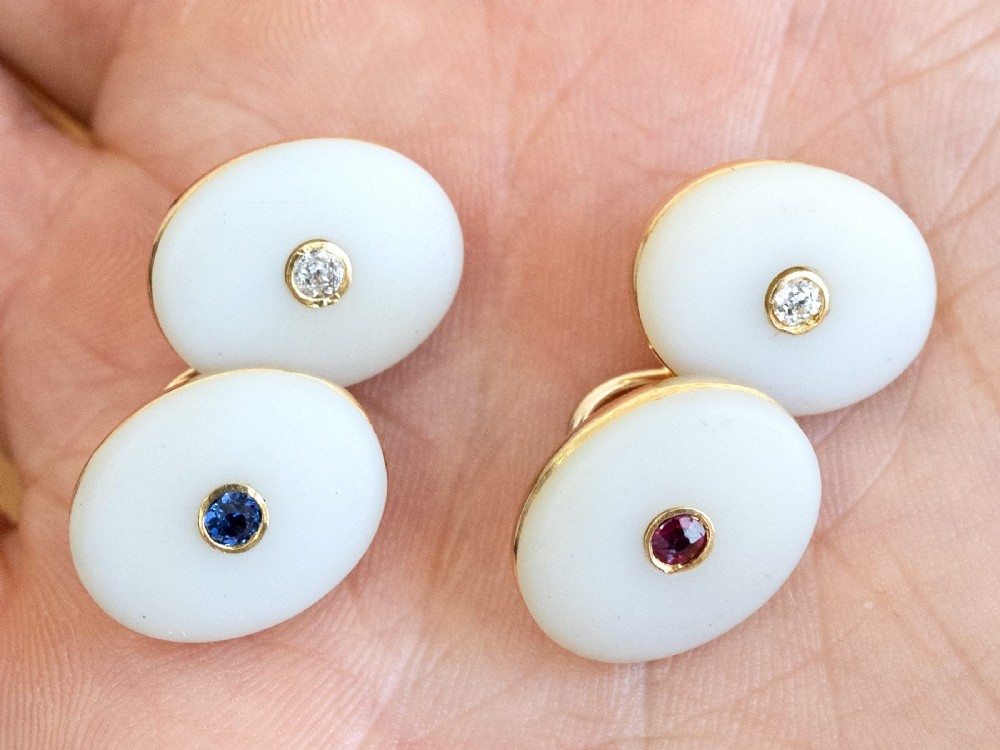 Four oval 15ct yellow gold cufflinks featuring smooth white agate faces with central bezel-set diamond, sapphire, and ruby gemstones. View III