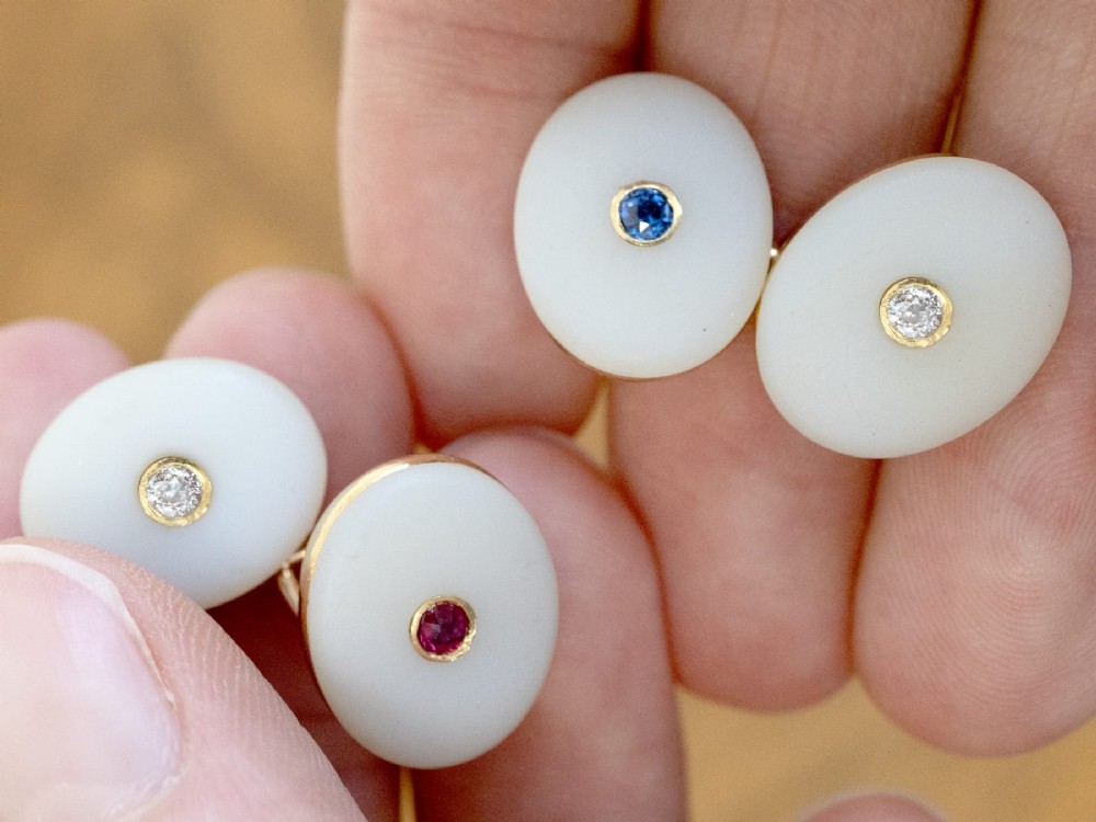 Four oval 15ct yellow gold cufflinks featuring smooth white agate faces with central bezel-set diamond, sapphire, and ruby gemstones. View IV
