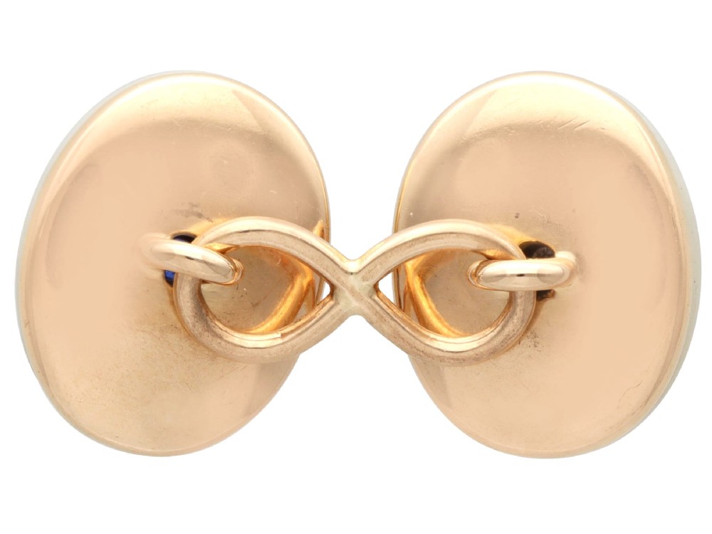 Four oval 15ct yellow gold cufflinks featuring smooth white agate faces with central bezel-set diamond, sapphire, and ruby gemstones. View X