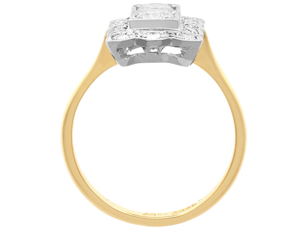 An Art Deco 18ct yellow gold dress ring with two central round diamonds within a rectangular millegrain halo setting. View IX