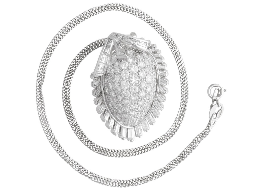 A 1950s vintage white gold organic pendant set with brilliant-cut diamonds and bordered by baguette-cut diamonds. View VII
