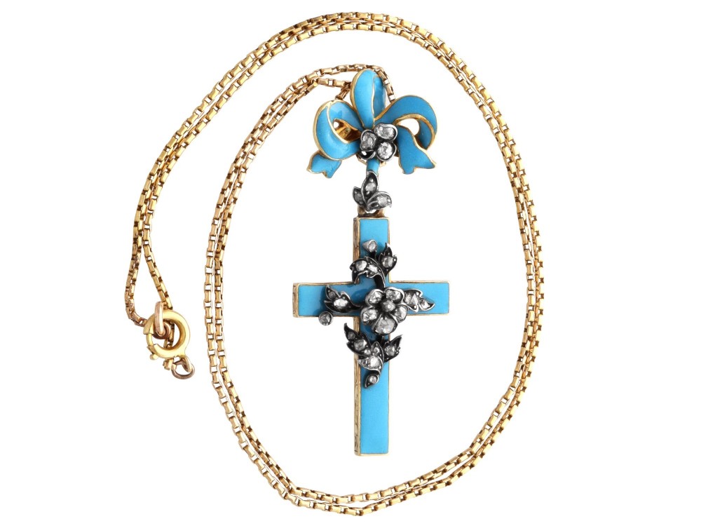A Georgian 15ct yellow gold cross pendant featuring blue enamel, a diamond-set ribbon bow loop, and floral diamond overlays. View VII