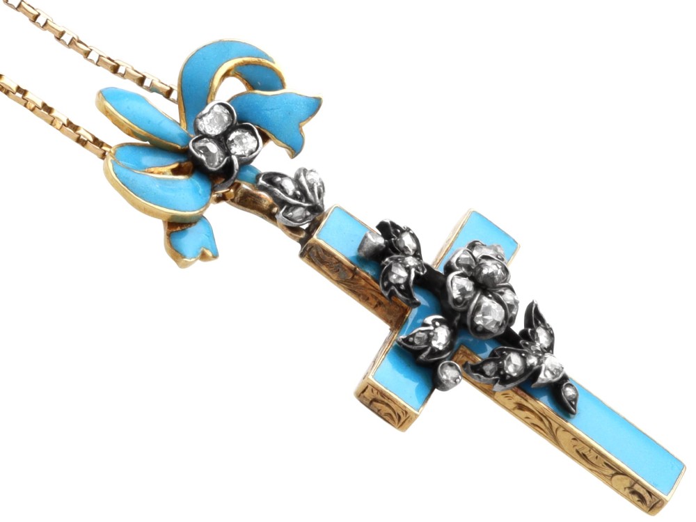 A Georgian 15ct yellow gold cross pendant featuring blue enamel, a diamond-set ribbon bow loop, and floral diamond overlays. View VIII
