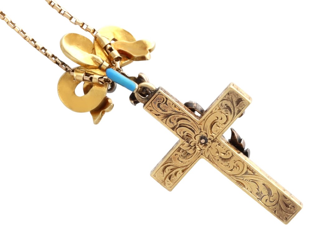 A Georgian 15ct yellow gold cross pendant featuring blue enamel, a diamond-set ribbon bow loop, and floral diamond overlays. View IX