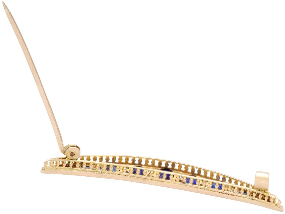 An antique late Victorian 9ct yellow gold crescent brooch set with graduated oval blue sapphires and accent diamonds. View VIII
