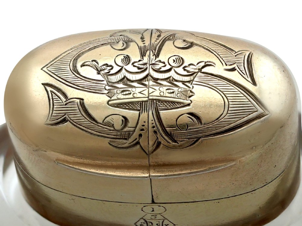 A Victorian clear glass scent bottle with fluted sides and engraved sterling silver caps at the top and base. View XIII