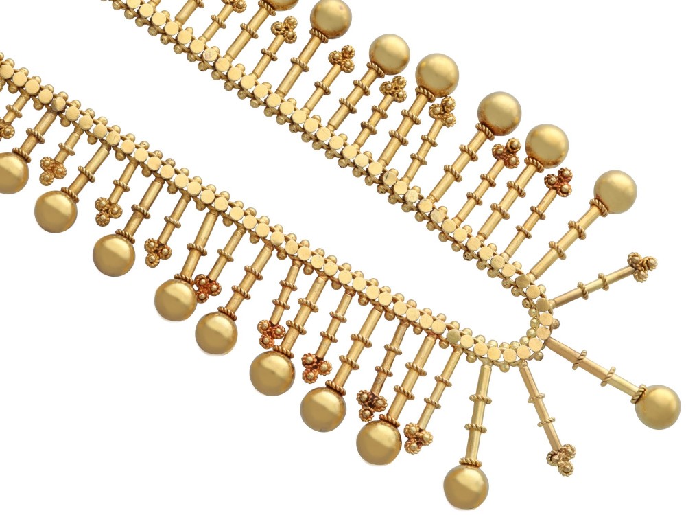 An antique 18ct yellow gold Victorian fringe necklace featuring articulated drop elements with spherical ball terminals and beaded details. View VIII