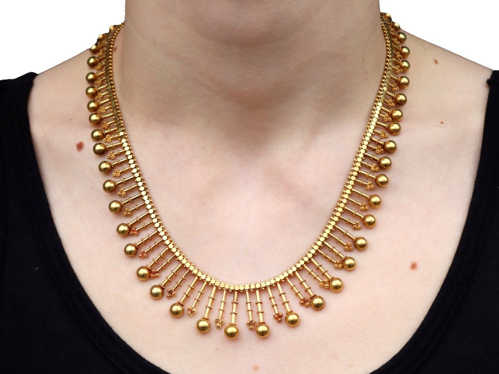 An antique 18ct yellow gold Victorian fringe necklace featuring articulated drop elements with spherical ball terminals and beaded details. View XII