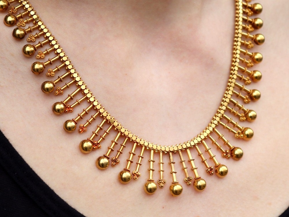 An antique 18ct yellow gold Victorian fringe necklace featuring articulated drop elements with spherical ball terminals and beaded details. View XIII