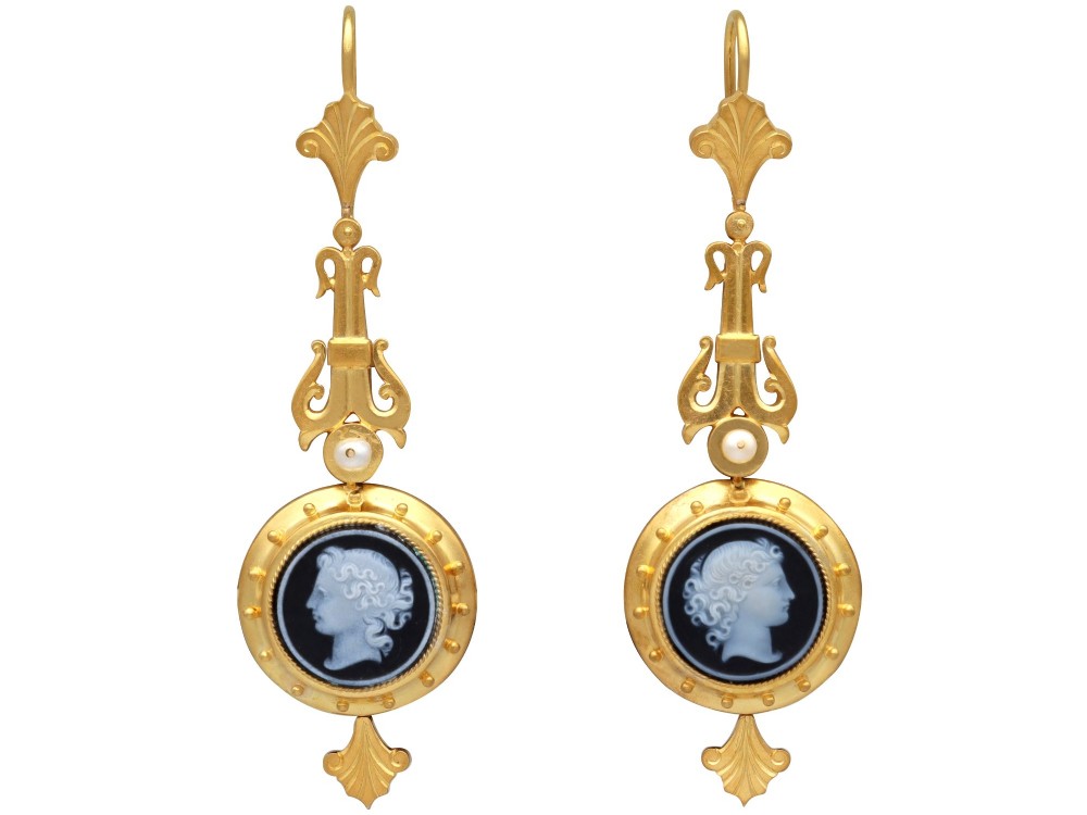A pair of late Victorian 22ct yellow gold drop earrings featuring hand-carved hardstone cameo profile portraits and small seed pearls.